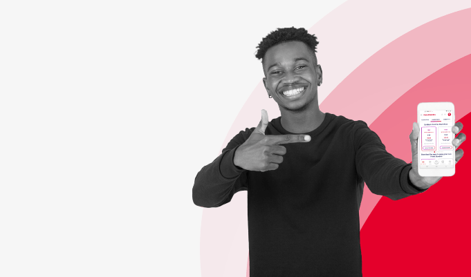 Man smiling pointing at phone