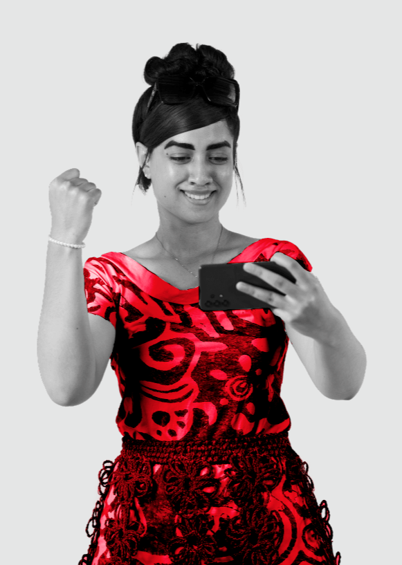 Woman fist pumping the air whilst using video call