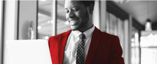 Guy with laptop in a red suit
