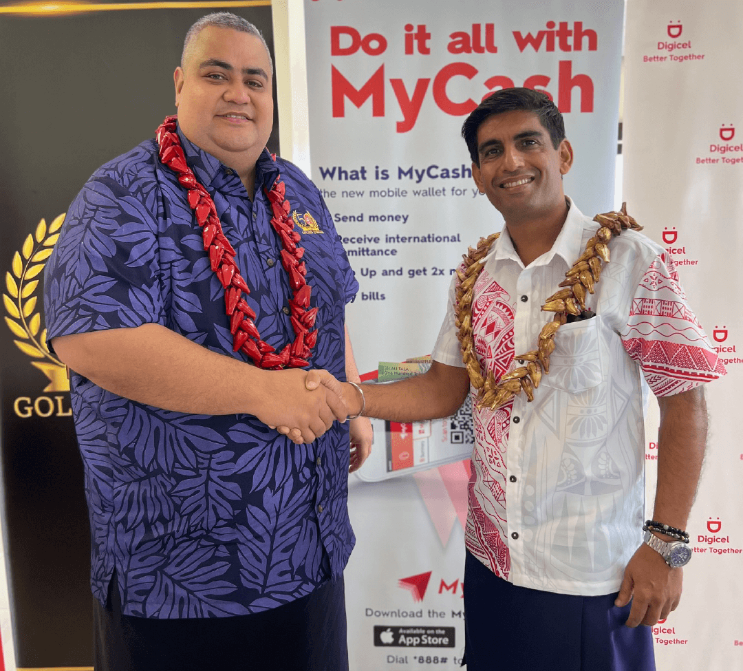 Deepak Khanna, Digicel Samoa CEO, shaking hands with Pauli Prince Suhren, SNPF CEO