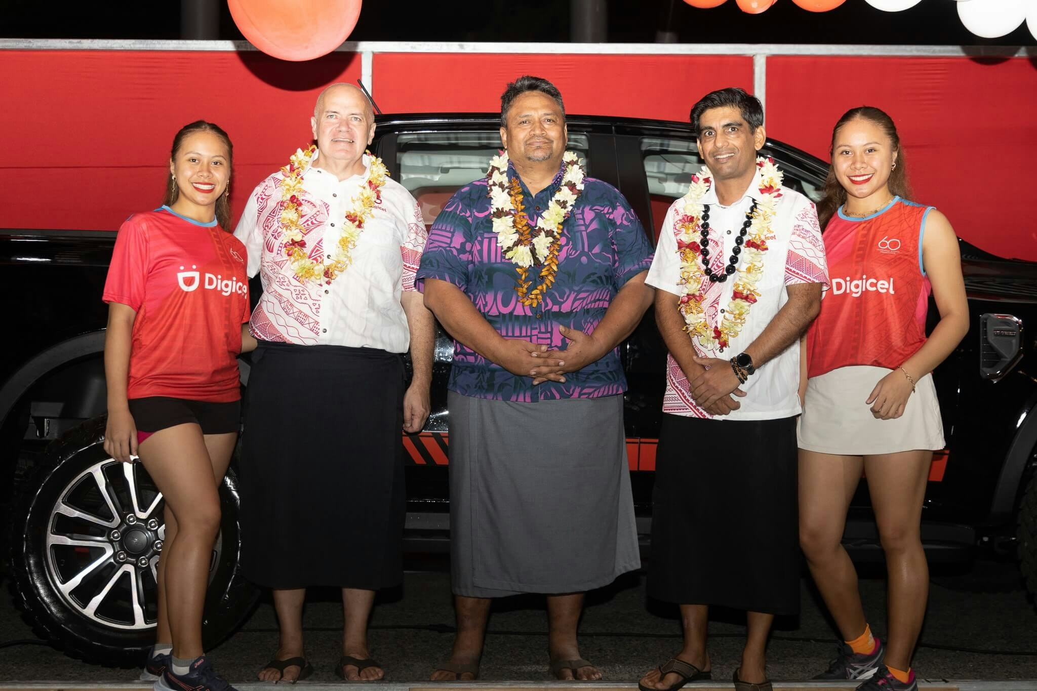 Digicel executives standing in front of a 2023 Ford Ranger XLT