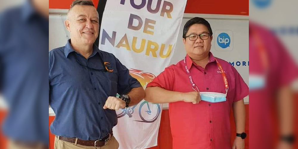Christopher Manaog, Digicel Nauru CEO, bumping elbows with Darren Howard, president of the Nauru Cycling Club