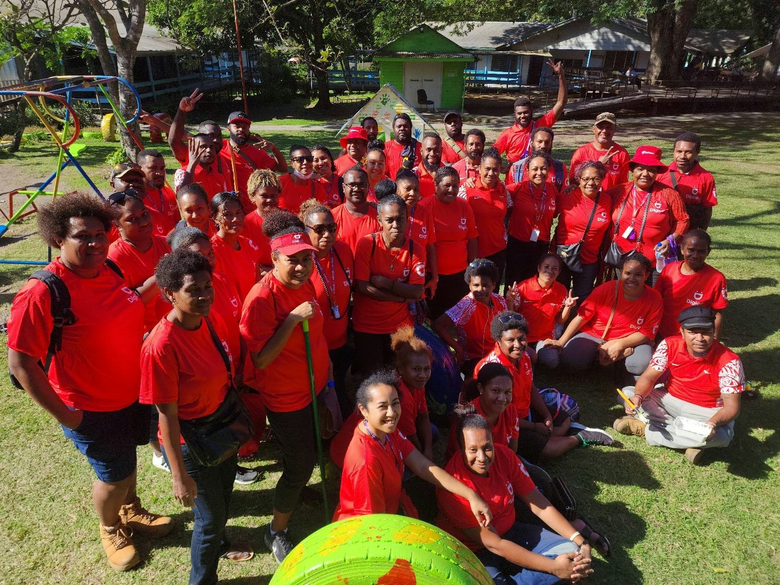 Digicel PNG staff after the cleanup and painting of classrooms and playground at Cheshire Disability Services in Port Moresby on 9th June 2023